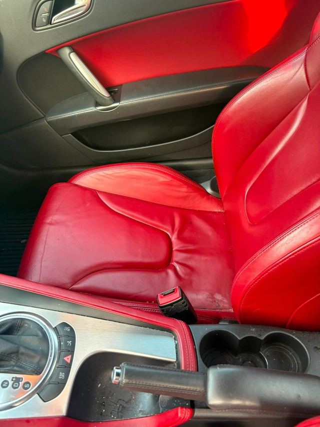 Audi TT before detailing: dusty red leather seats and console
